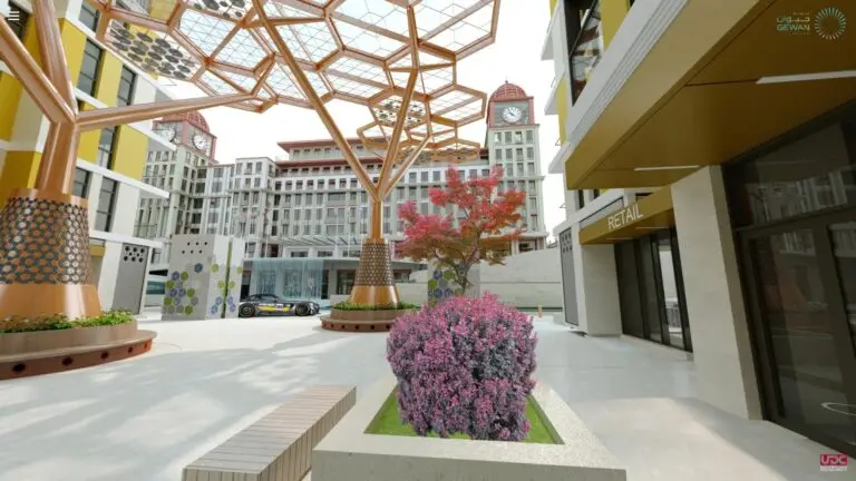 A preview of a 3D model showing a modern architectural plaza with hexagonal patterned metal structures and red-leaved trees. Buildings have clock towers and the foreground features a purple flowering bush in a concrete planter.