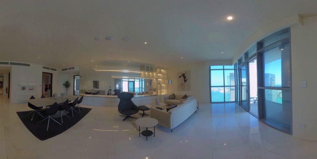 A preview of 360 degrees scanning for VR experience of spacious modern living room with large windows offering a cityscape view.