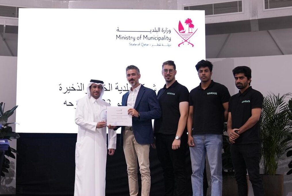 Vraxa team on stage getting award for their collaboration with Al-Khor Municipality in Qatar